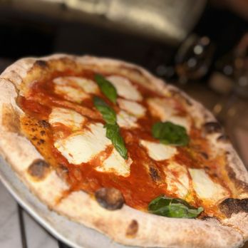 Osteria signature dishes Rigatoni with Chicken Liver RaguGrilled OctopusNeapolitan and Roman-style PizzasLombarda Pizza